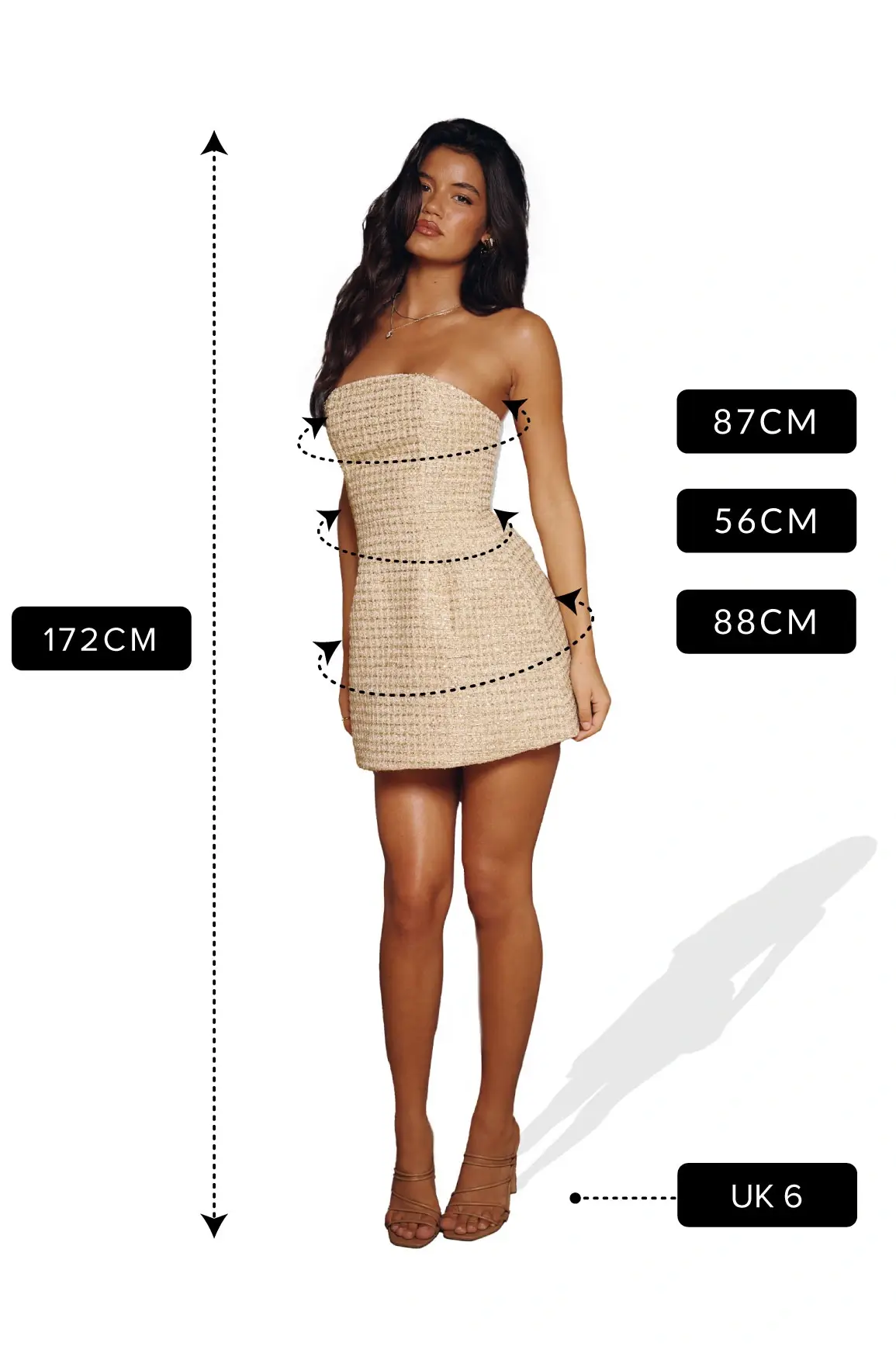 Model wearing a beige strapless mini dress with measurements shown: height 172 cm, bust 87 cm, waist 56 cm, hips 88 cm, size UK 6
