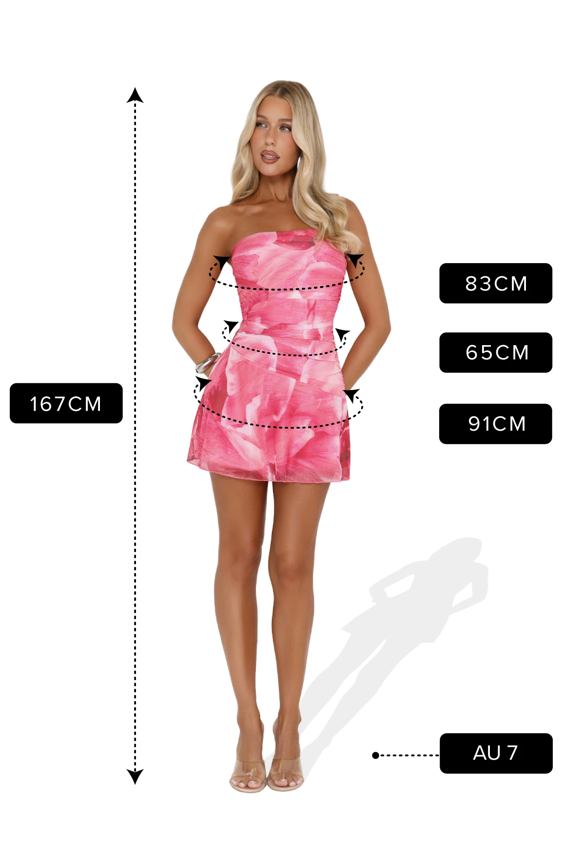 Studio image of a woman wearing a strapless pink patterned mini dress and nude heels. Measurement graphics show her height as 167 cm, bust 83 cm, waist 65 cm, hips 91 cm, and shoe size AU 7.