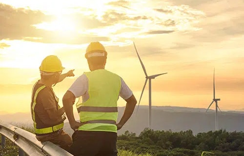 Workers pointing towards wildfire smoke