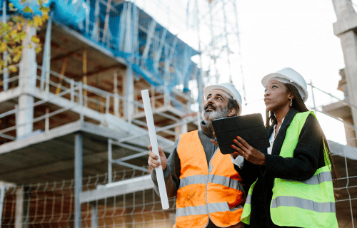 male and female construction workers