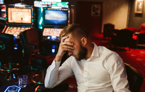 man with gambling addiction in casino