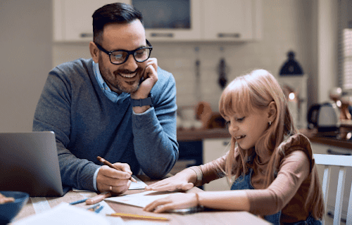 Father helping daughter with homework
