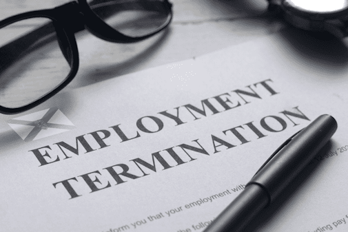 Employment notice on a desk with glasses and pen lying on top of it.