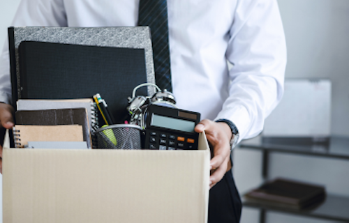Employee packing up desk after being terminated