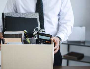 Employee packing up desk after being terminated