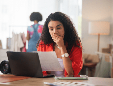 Small business owner looking at her finances