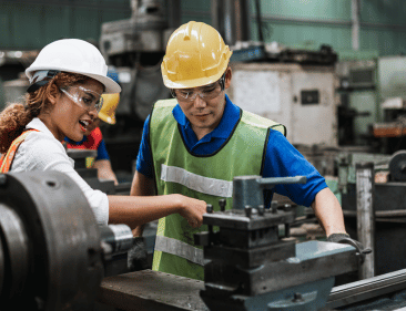 Small business owner helping employee