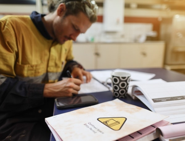 Worker filling out paperwork