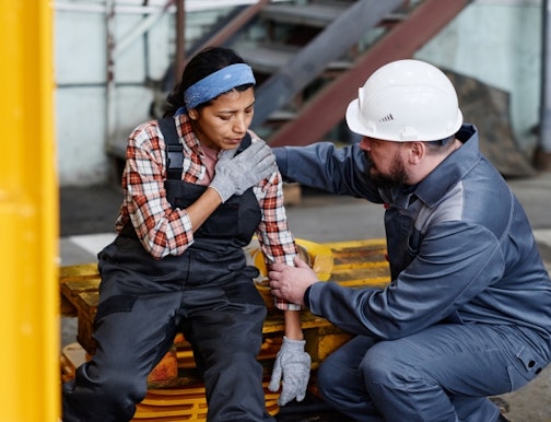 Injured worker being assessed by safety rep
