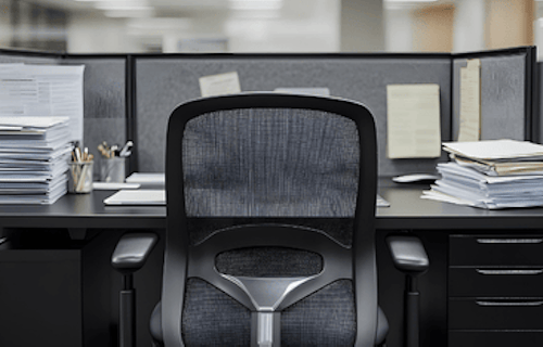 An empty office cubicle indicating employee absence