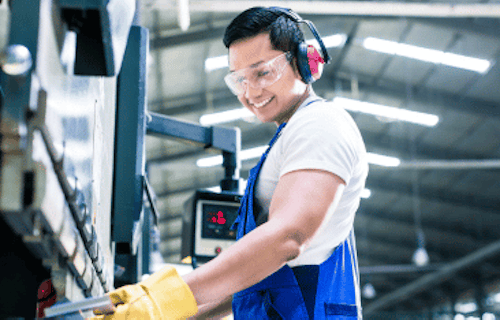 Employee working with safety glasses and protective gloves on