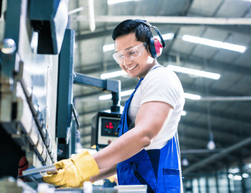 Employee working with safety glasses and protective gloves on