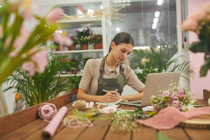 Minimum wage employee handling accounts at flowershop in PEI