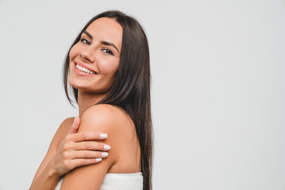 woman with long dark hair smiling