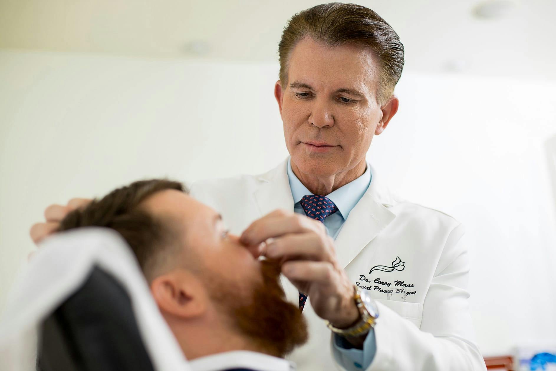 Dr. Maas with a male patient