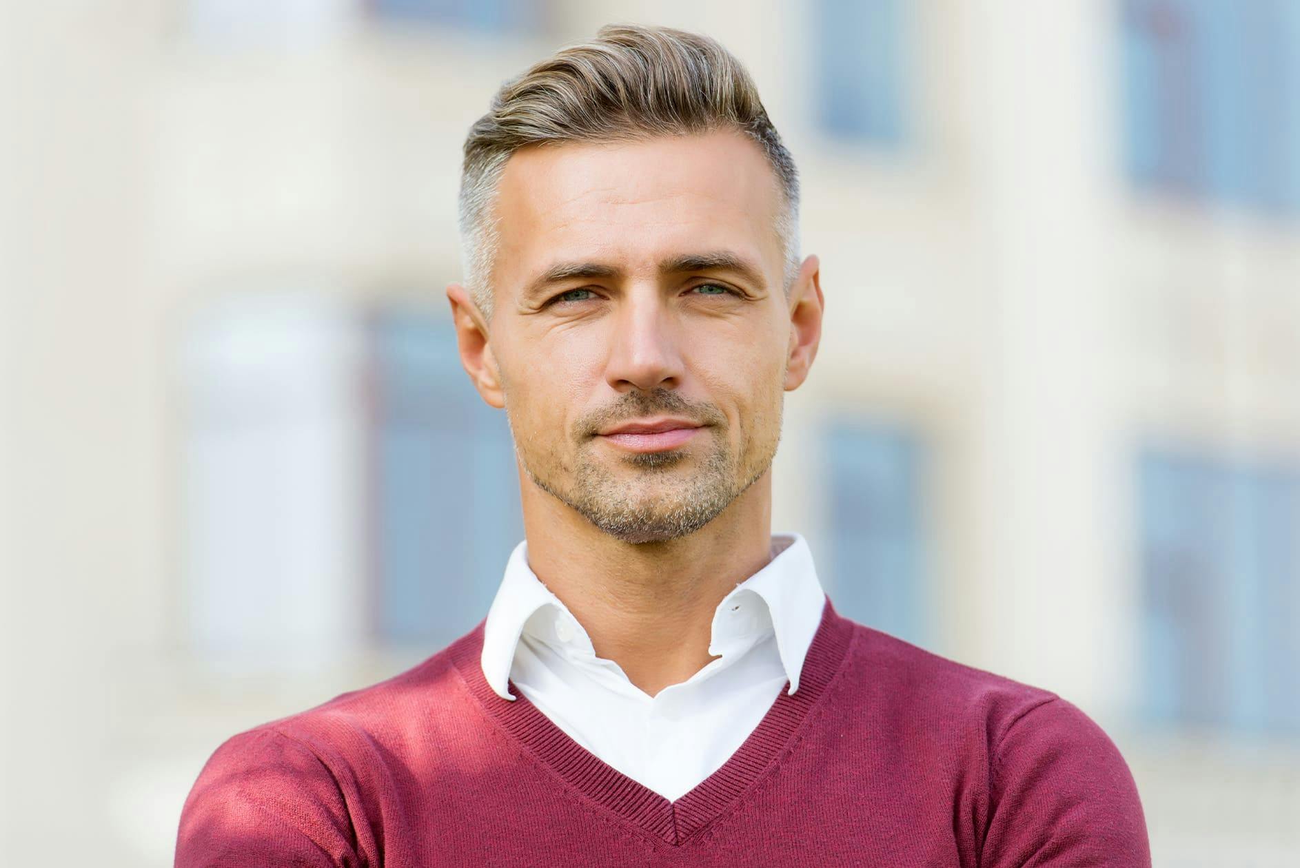 man in red sweater looking forward