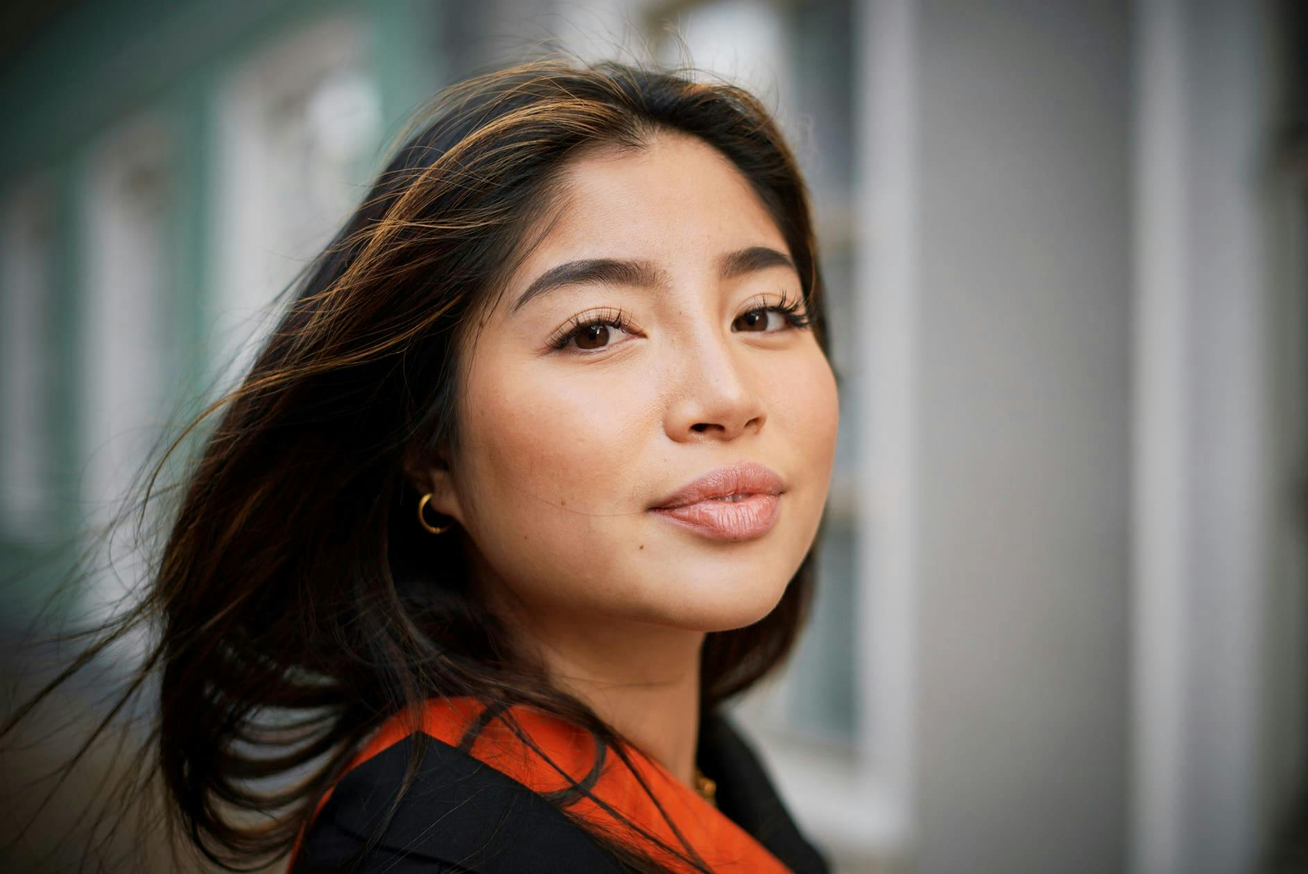 woman with dark hair with highlights