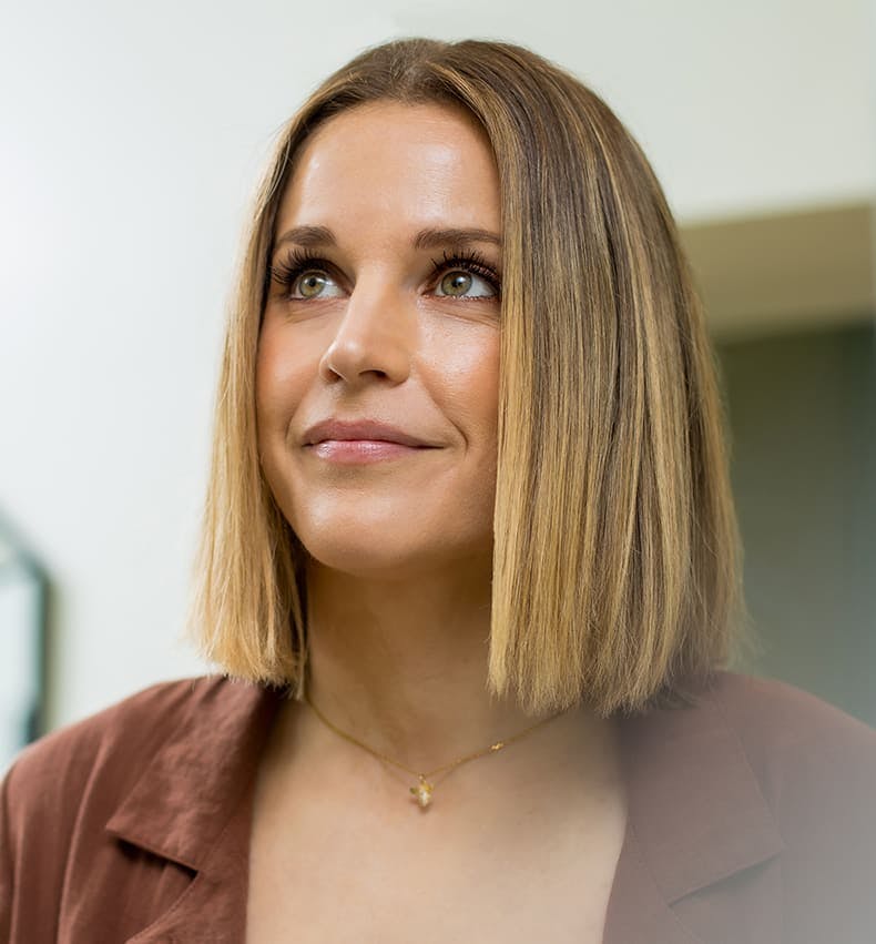 woman with short bob looking to the left