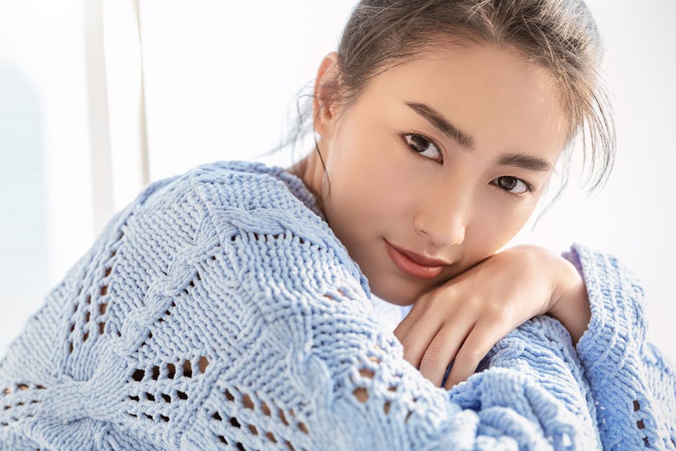 woman in light blue sweater