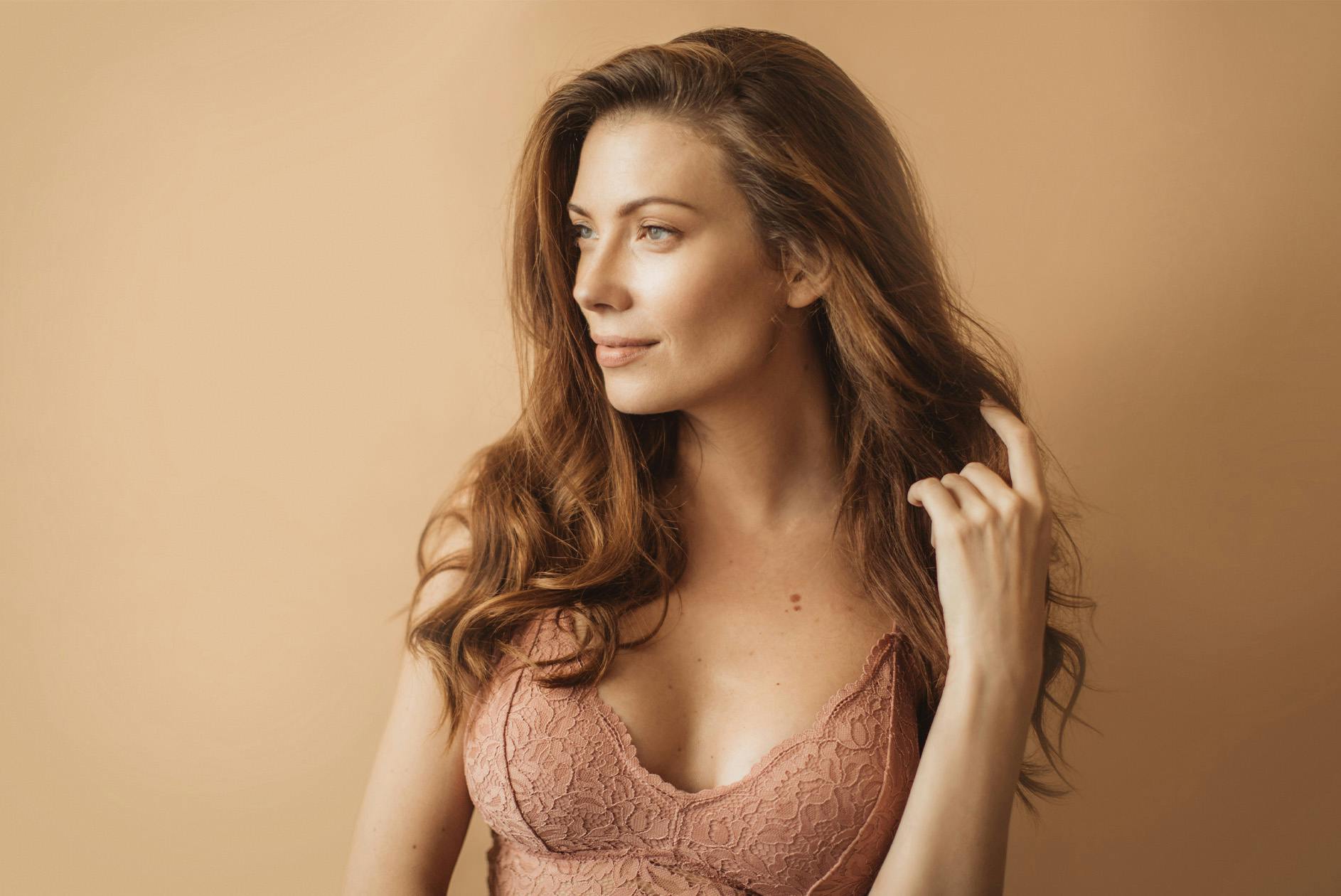 woman in a pink bralette