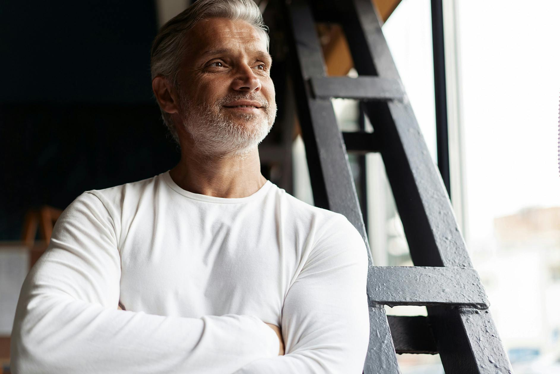 man with grey hair and beard