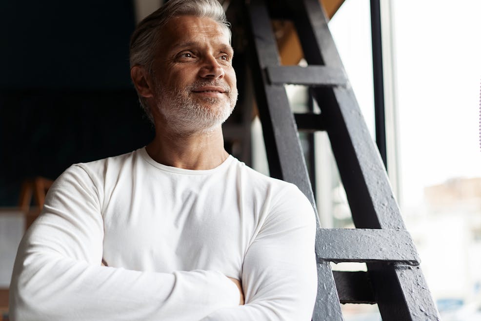 man with grey hair and beard