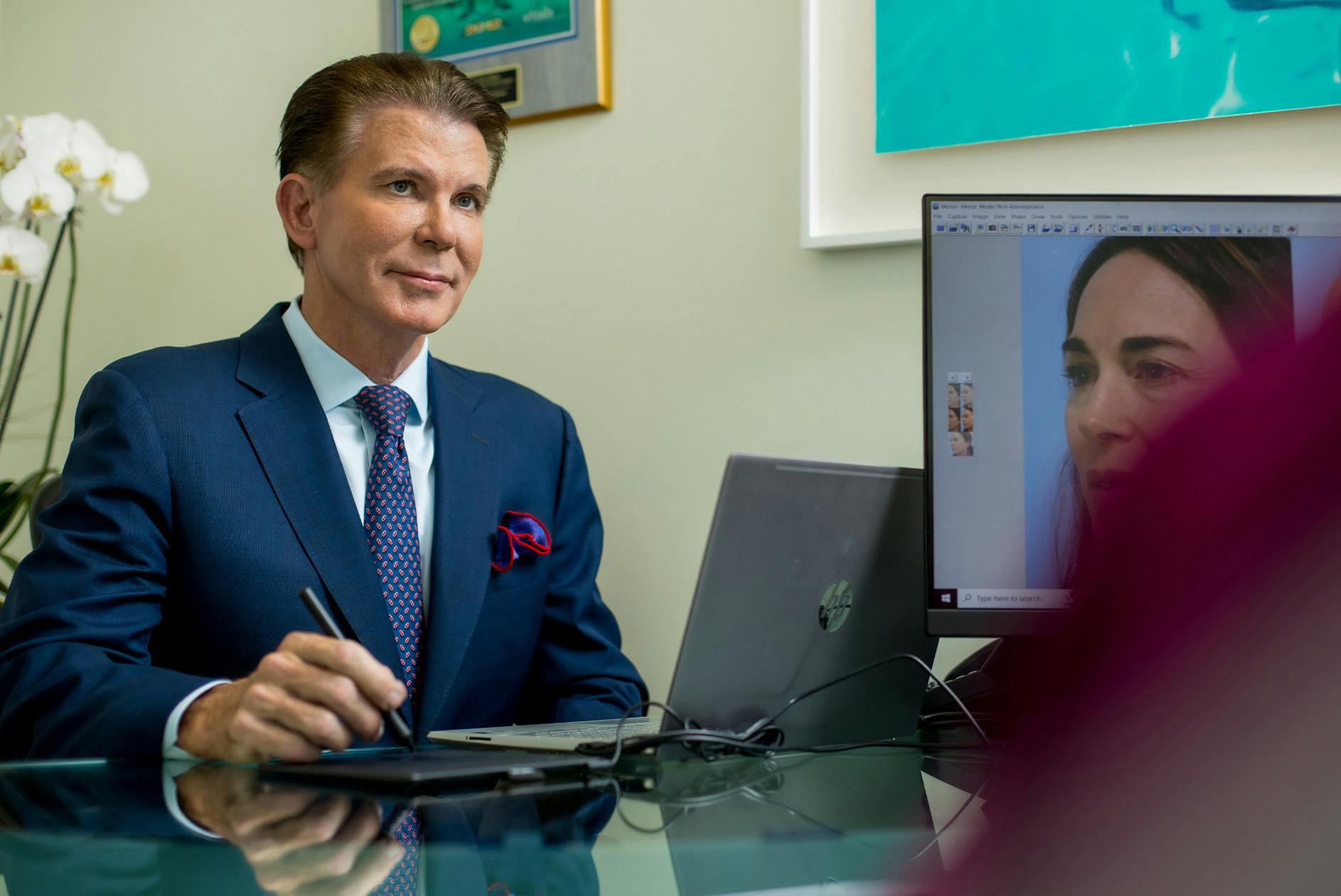 Dr. Maas working on computer