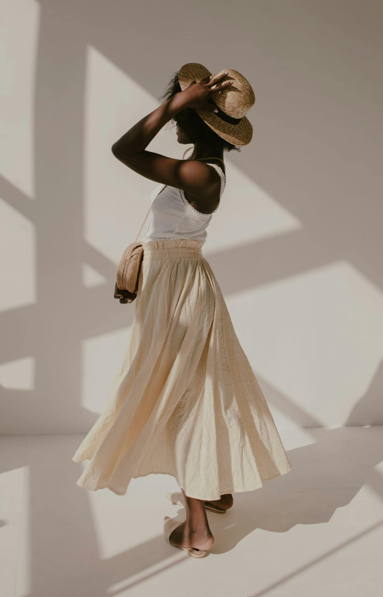 Black woman in a summer hat