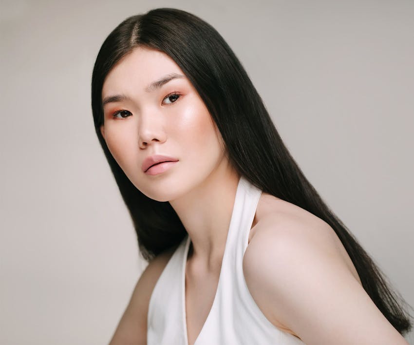 asian woman with long straight hair facing forward