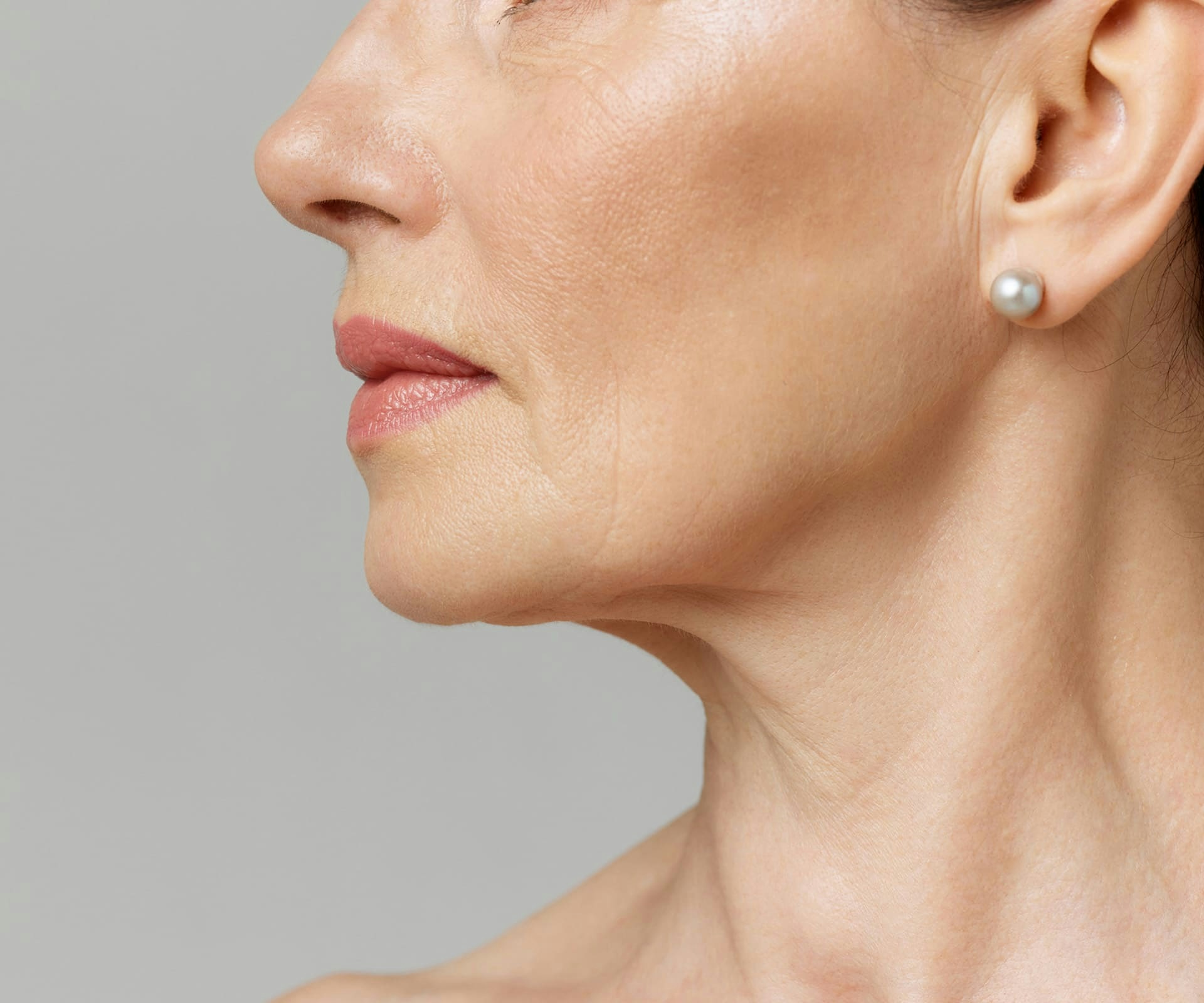 close up on side profile of older woman's neck