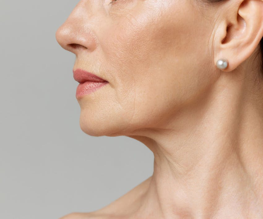 close up on side profile of older woman's neck