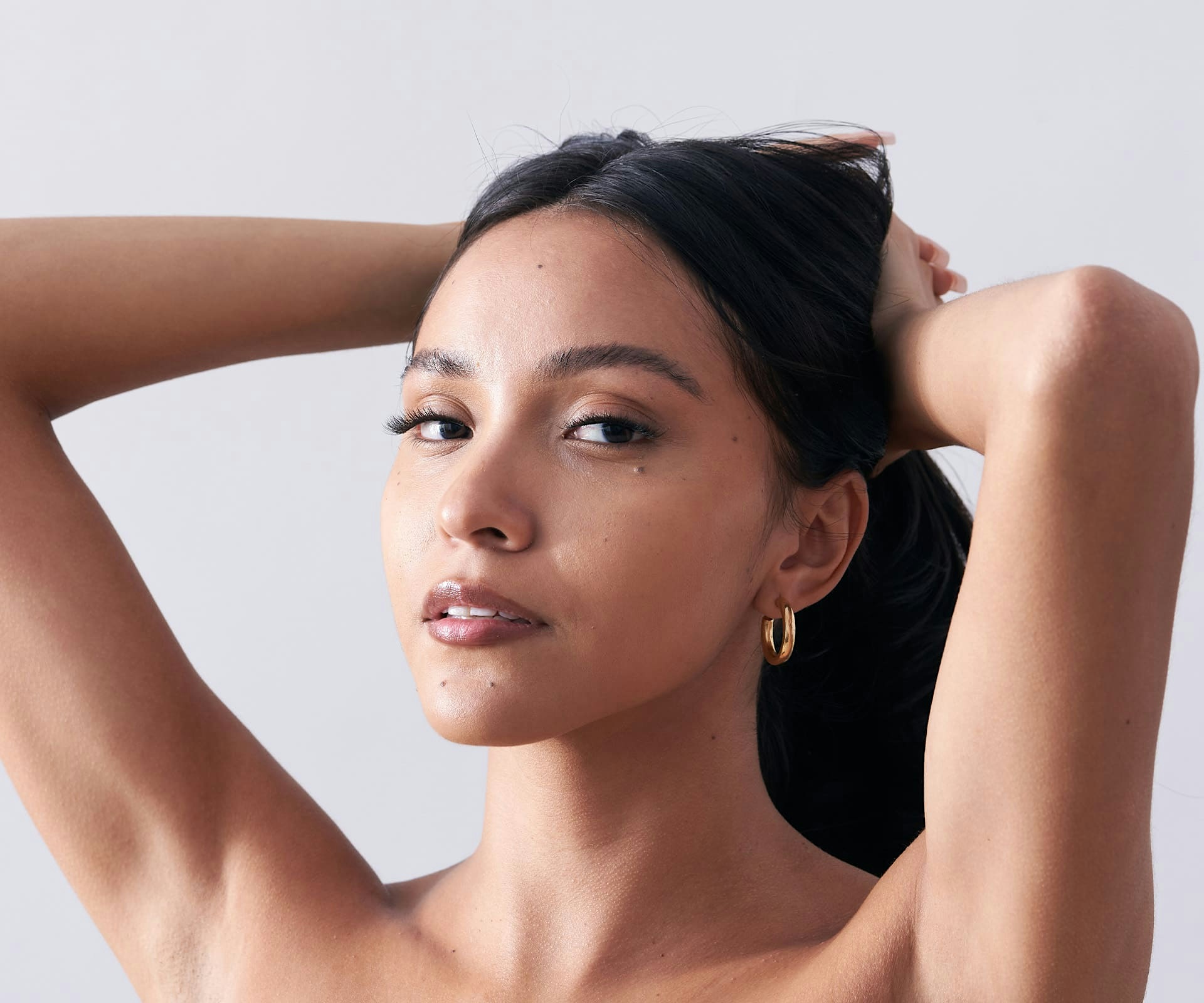 woman holding her hair back