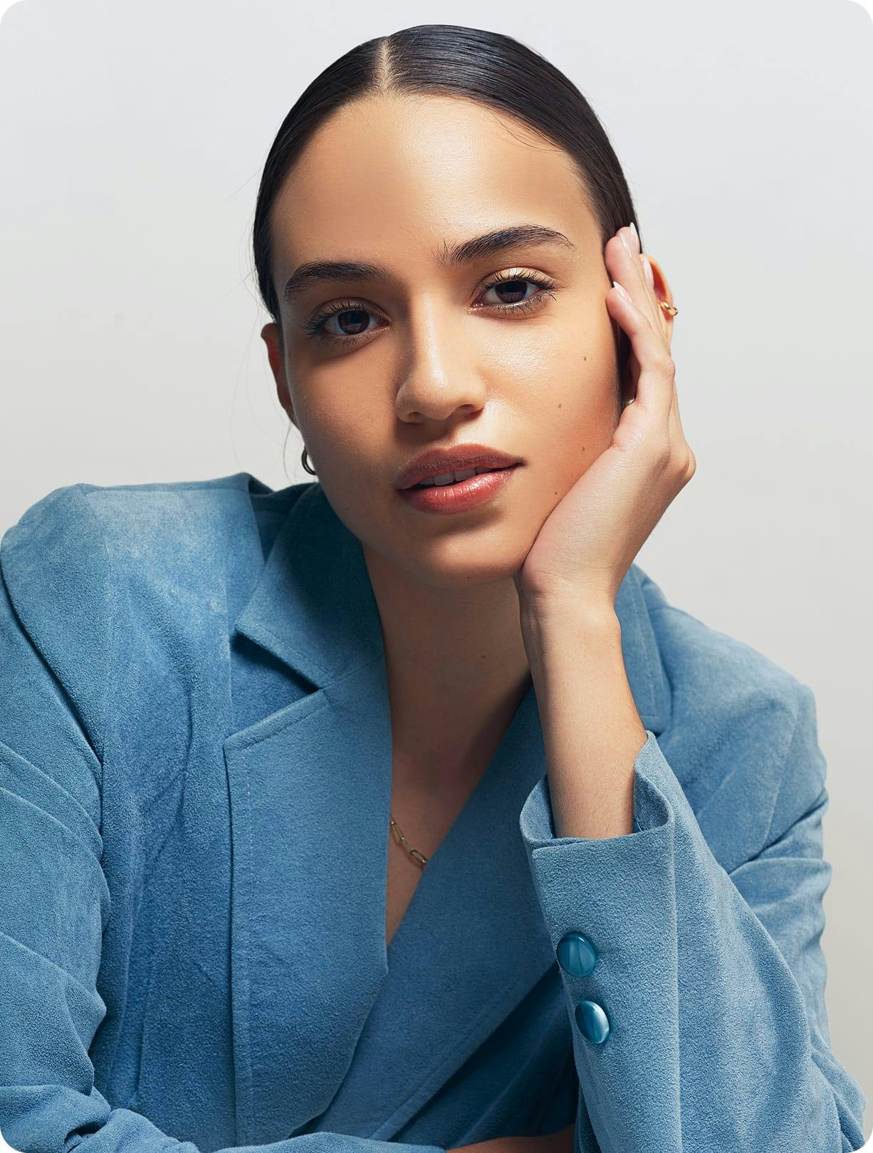 Woman with a hand to her face