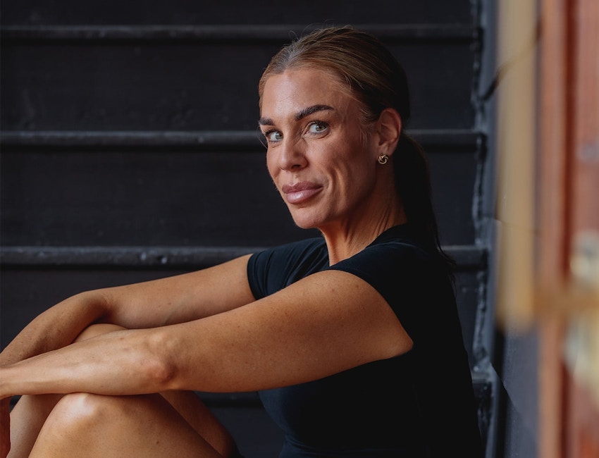 woman sitting on floor facing to the right