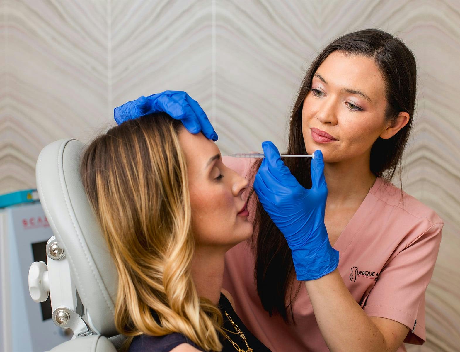 woman getting injection in her forehead