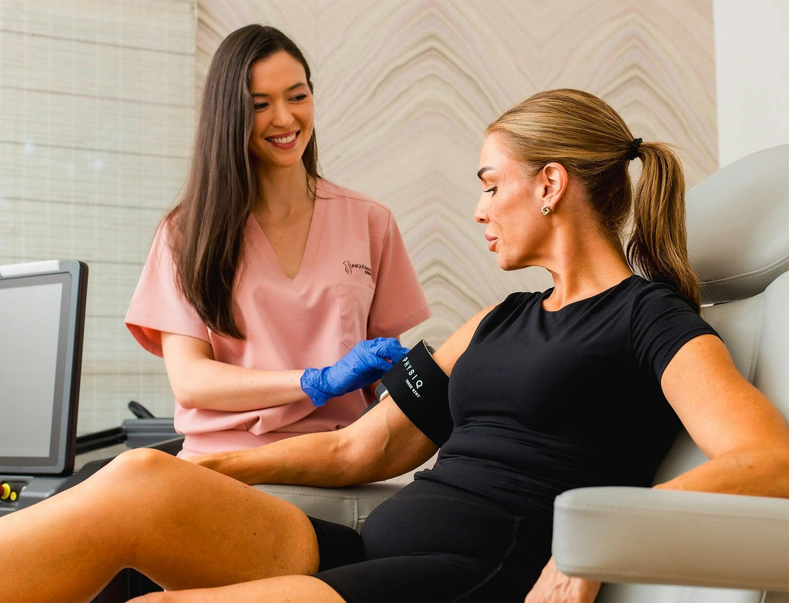 nurse taking patients blood pressure