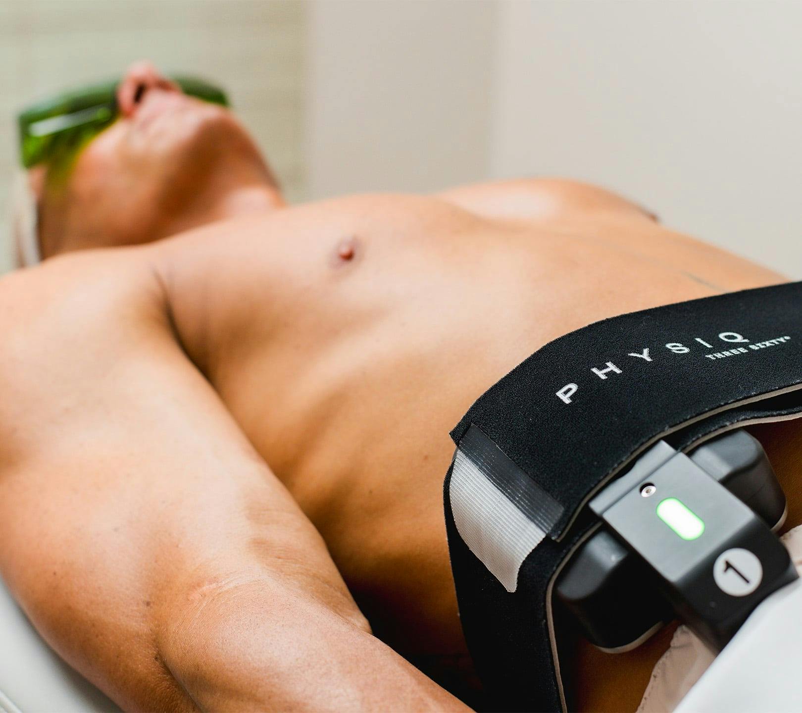 man getting body treatment done on her lower stomach