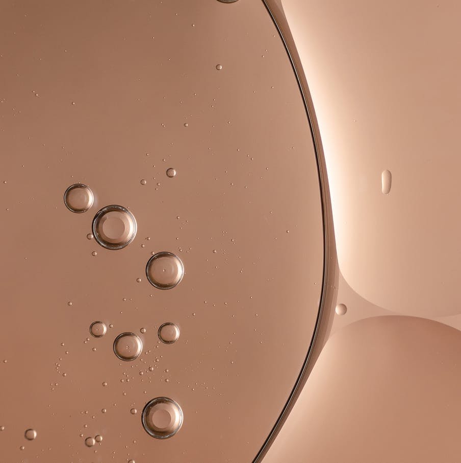 Close-up of liquid bubbles on a copper surface