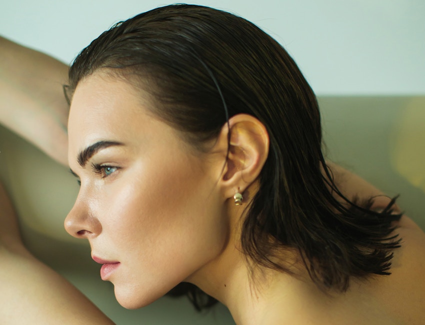 Woman with arms in front of her