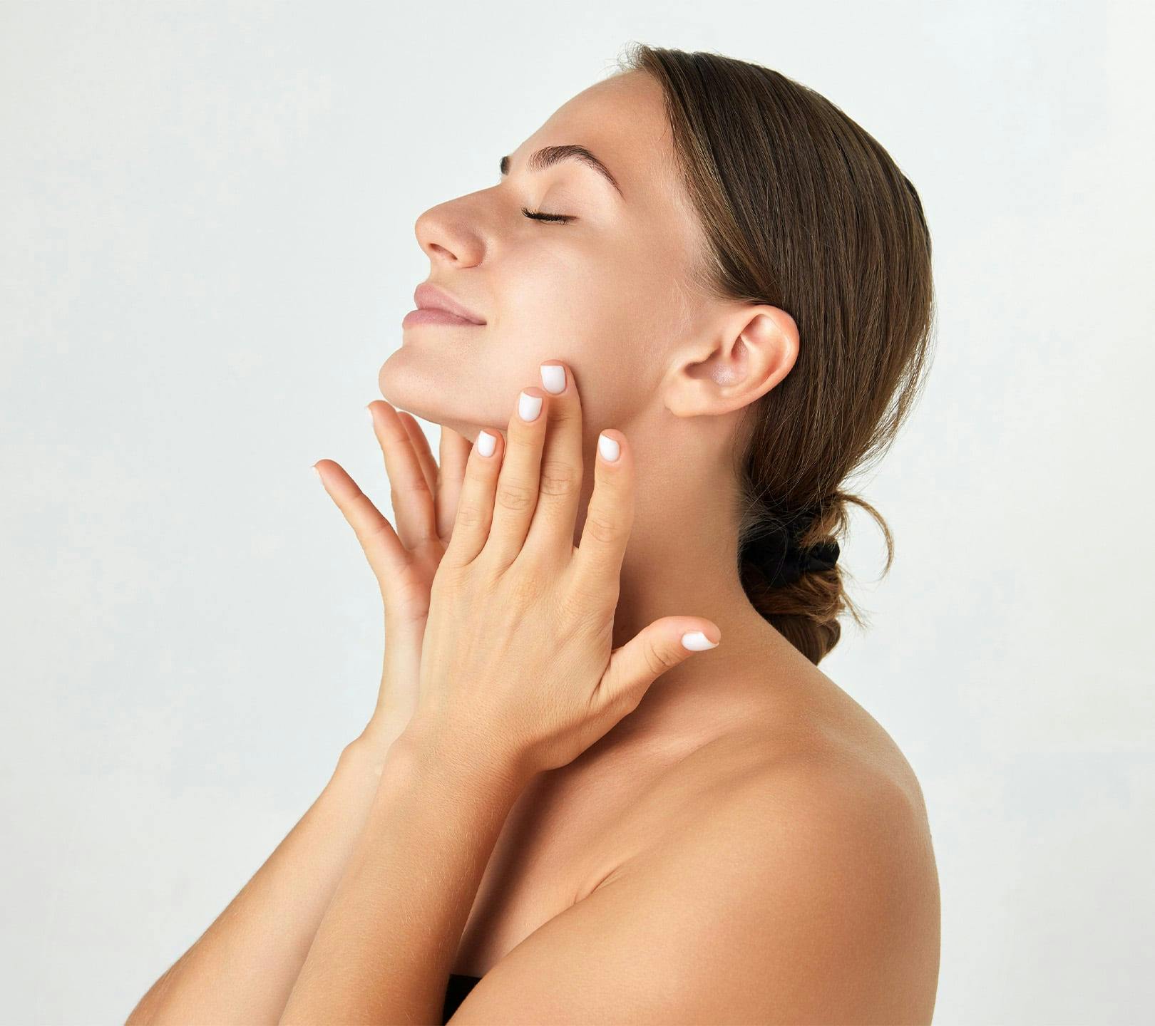 woman with her hands on her face