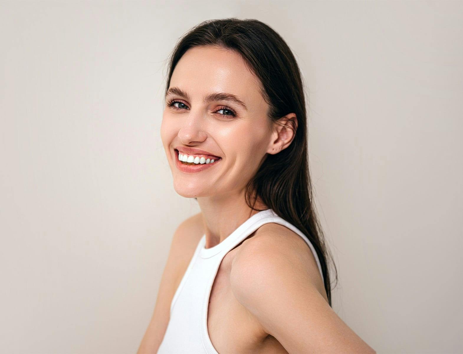 woman in a white shirt smiling