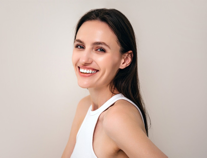woman in a white shirt smiling