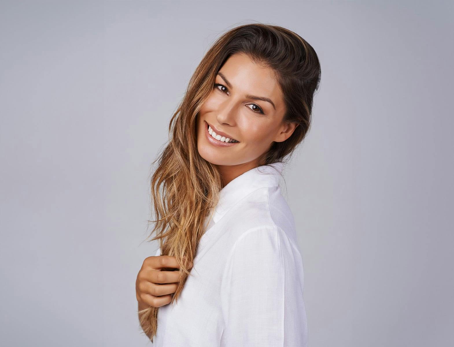 woman in white shirt smiling