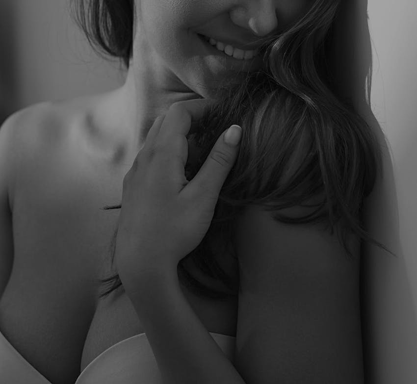 woman smiling and looking to the side