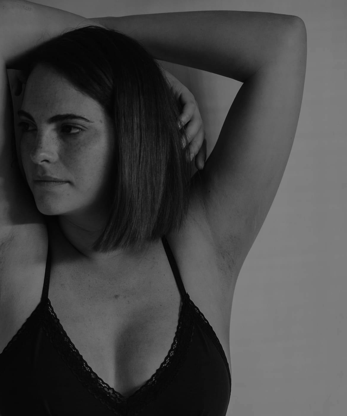 woman with her arms above her head