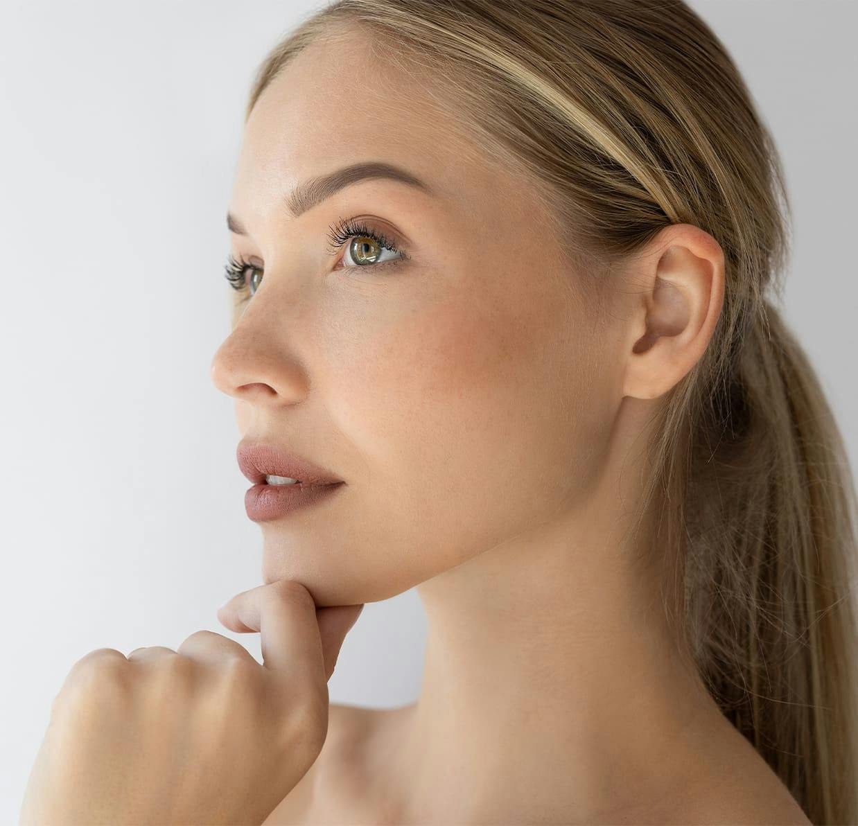 woman touching her chin