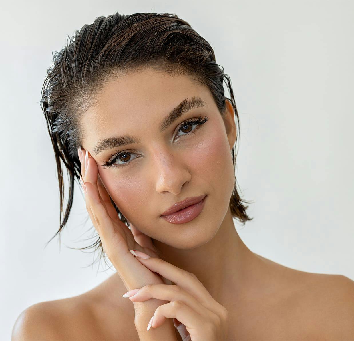 woman touching her face