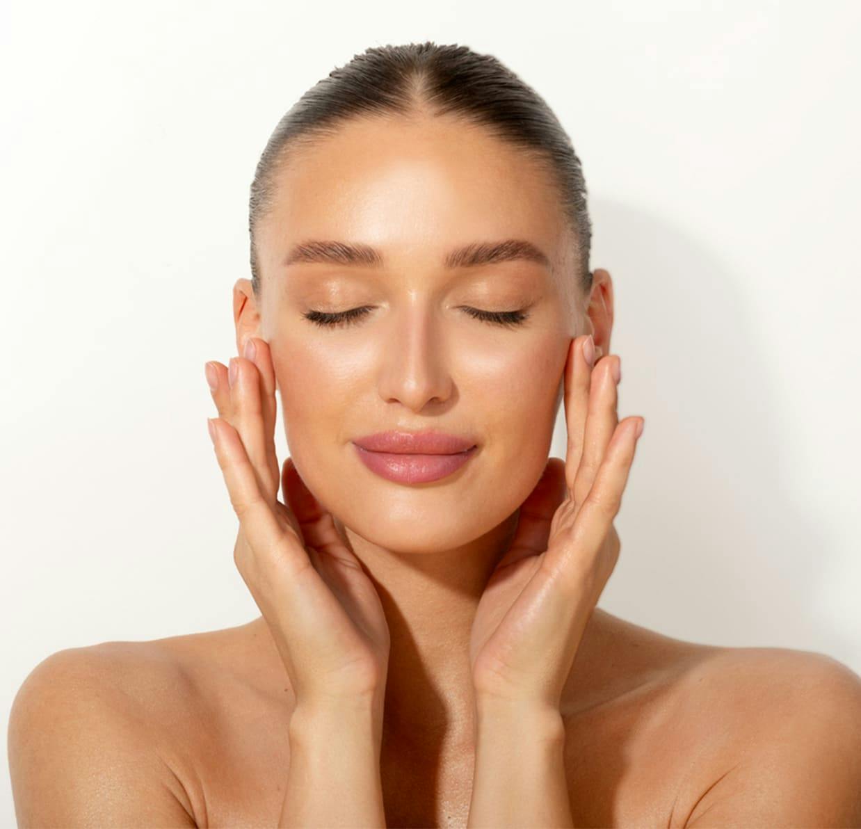 woman touching her face