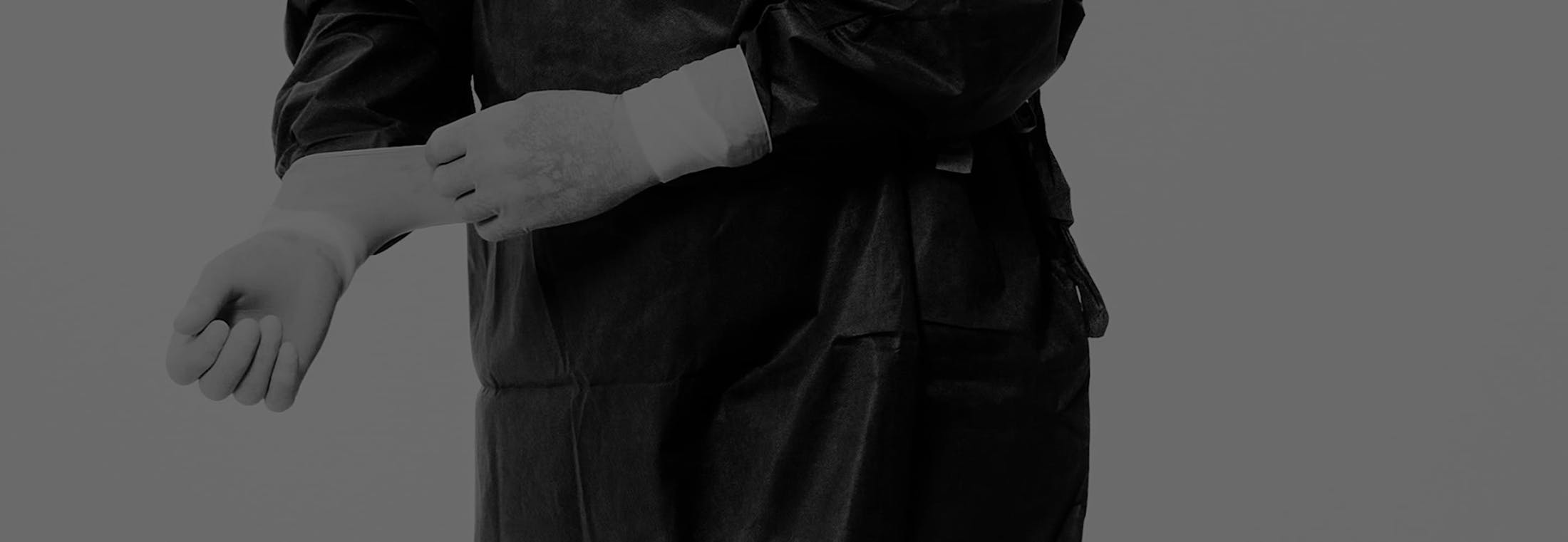doctor pulling on gloves
