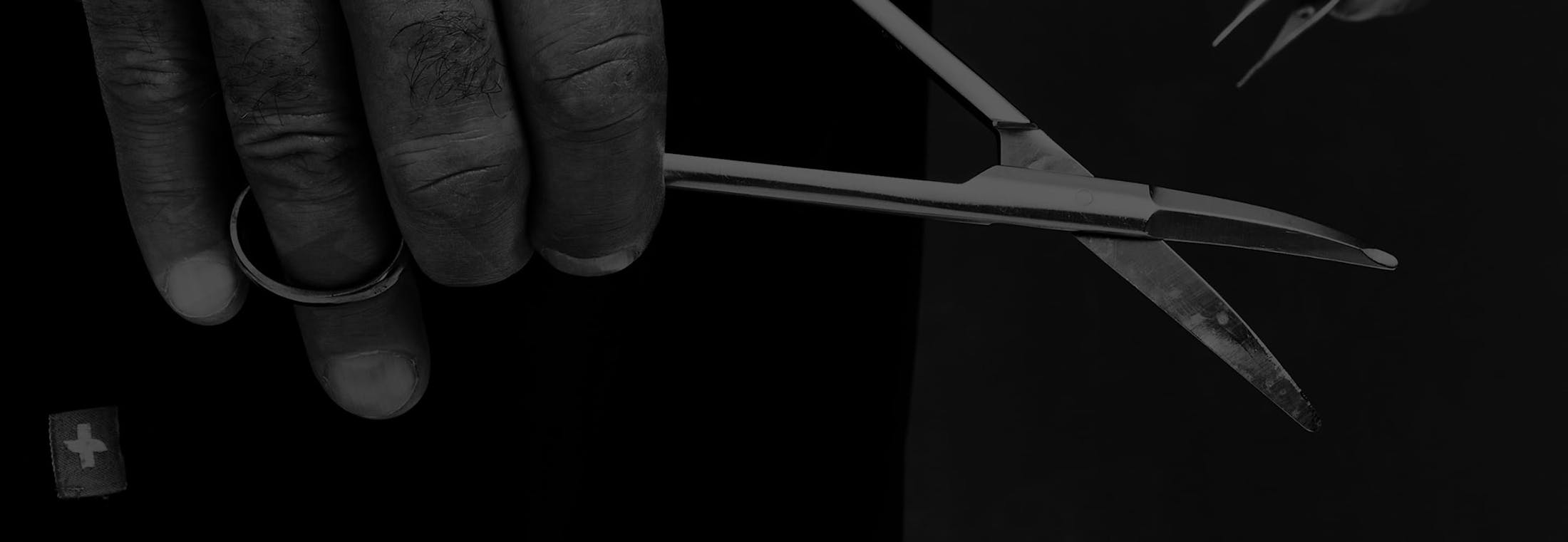 Dr. Fisher grabbing a medical tool